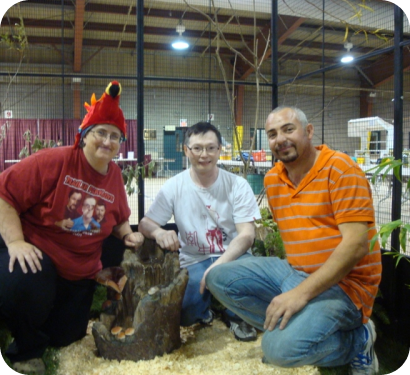 Visitors with a bird at the show